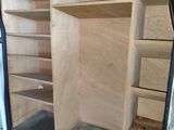 a white van with shelves in the back of it