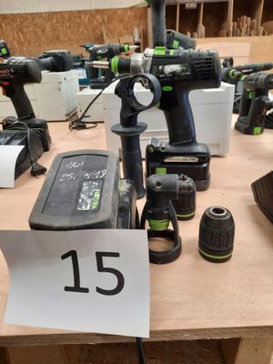 a lot of power tools on a table with a price tag