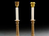pair of antique brass candlesticks with white candlesticks