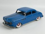 a blue toy car that is sitting on a white surface