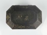 a black and gold tray with a picture on it