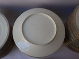 several plates are stacked on top of each other on a table