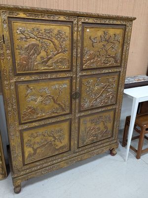 a wooden cabinet that has many drawers on it