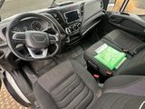 the interior of a vehicle with a steering wheel and a dashboard