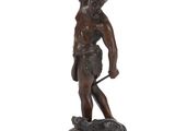 an image of a bronze statue of a man holding a lasset