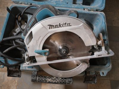 a circular saw in a case on the floor