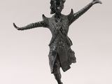 an image of a bronze statue of a man with his arms outstretched