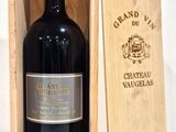 a wooden box with a bottle of wine inside of it