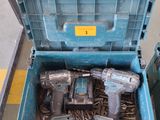 a blue tool box with tools in it on the floor