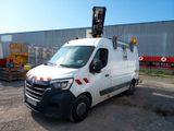 a picture of a white van parked in front of a building