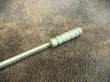 a toothbrush that is laying on the floor