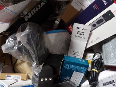 a pile of assorted electronics and electronics on a table