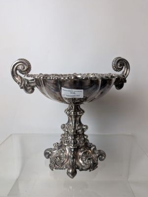 silver plated bowl on clear glass table with white background