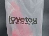 a plastic bag with a pink heart inside of it