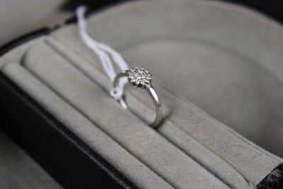 a ring that is sitting in a box on a table