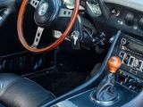 a steering wheel and dashboard of a sports car