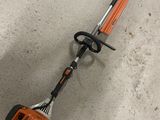 a close up of a string trimmer on the floor