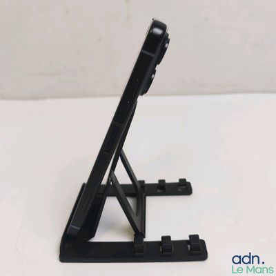 a black tablet computer on a stand on a white table