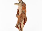 an old statue of a man holding a stick on a white background
