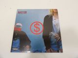 a cd with a picture of a man and a dollar sign on it