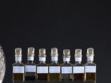 bottles of liquor on display in front of a black background