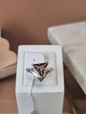 a ring that is sitting in a box on a table