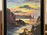 a picture of a painting hanging on a wooden easel