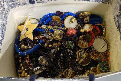 a bag full of jewelry sitting on a table