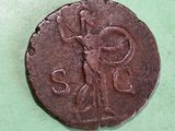 an old coin with an image of a woman on it