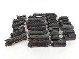 a lot of black and red trains on a white surface