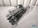 a lot of screws in a plastic bag on a table