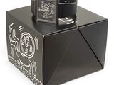 a black box with a watch on top of it