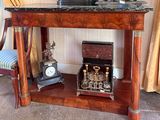 a small table with a clock on top of it