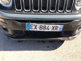 a close up of the front of a car with a license plate on it