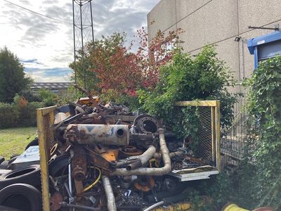 a truck that has a bunch of junk in the back of it