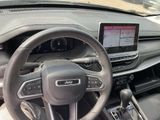 dashboard of a car with a steering wheel and dashboard controls