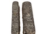 pair of antique silver plated hairbrushes on a white background