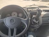 dashboard of a vehicle with steering wheel and dashboard controls
