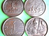 four silver coins with a picture of a man and a woman on them
