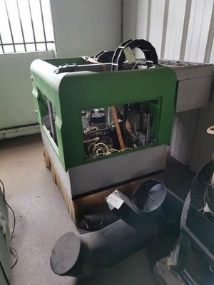 a green machine that is sitting in a room