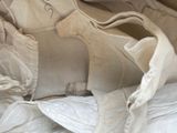 a close up of a pair of shoes that are on a bed