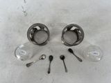 spoons, spoon resters, and a measuring spoon on a table
