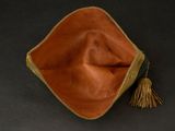 leather pouch with tassel on a black background
