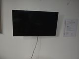 a flat screen tv mounted on the wall in a room