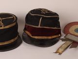 two hats that are sitting next to each other on a table