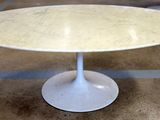a white table with a marble top in a room