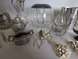 a lot of silver items on the table