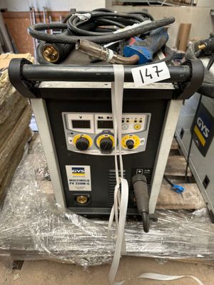 a couple of welding equipment sitting on top of a table