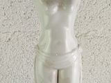 a statue of a woman holding a bowl on her head