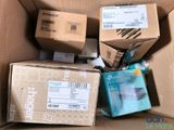 a cardboard box filled with many different types of electronic devices